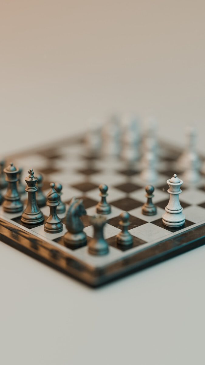 Chess pieces are arranged on a chessboard.