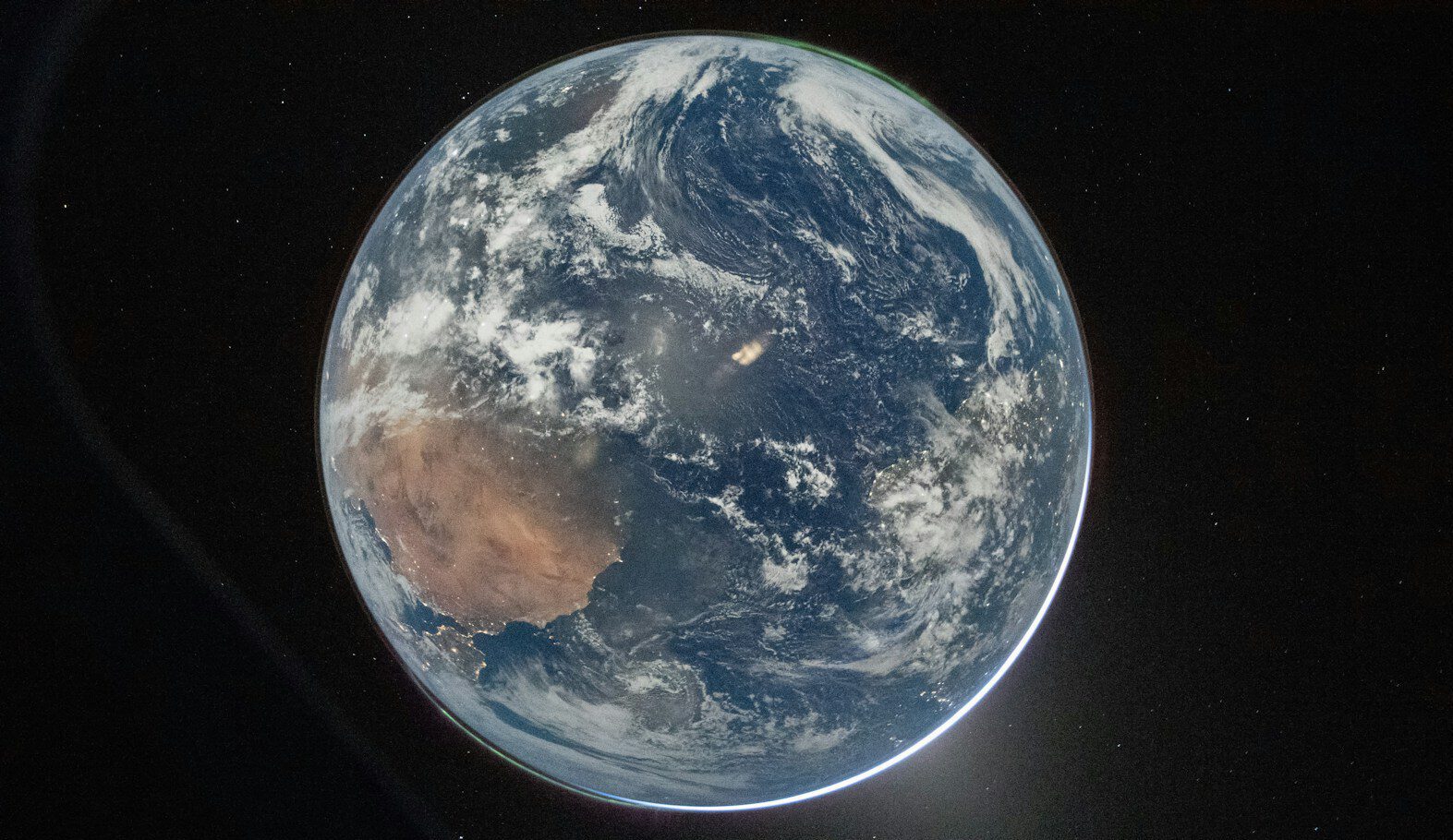 View of planet earth from space with clouds.